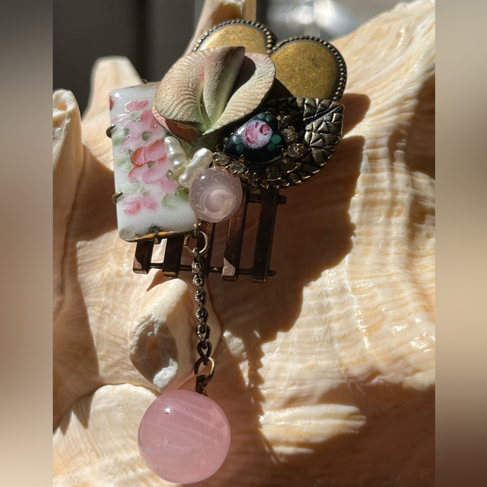 Antique brooch with brass heart, pain, and freshwater pearls